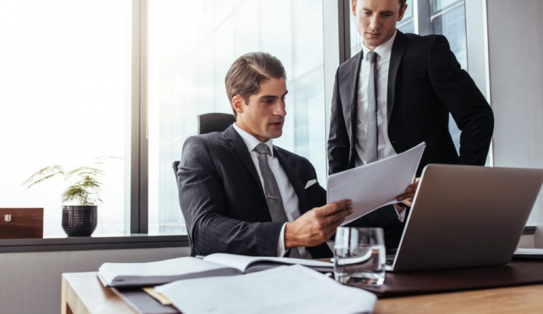 business people reading papers 1024x593 1 768x445